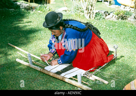 Woman weaving fabric, Inti Wata Cultural Complex, Sun Island, Lake Titicaca, near Copacabana, Bolivia Stock Photo