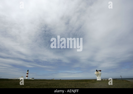 Point of Ayre Lighthouse and foghorn with emphasis on big blue sky with whispy white clouds Isle of Man IOM Stock Photo
