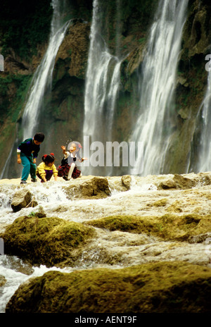 Huangguoshu Falls Guizhou China Children playing in water below main falls of China s largest waterfalls  Stock Photo