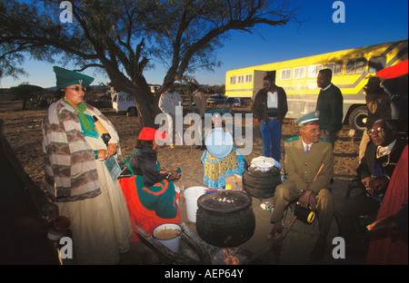 Namibia Okahandja, Red Flag Herero cooking food outdoors Stock Photo