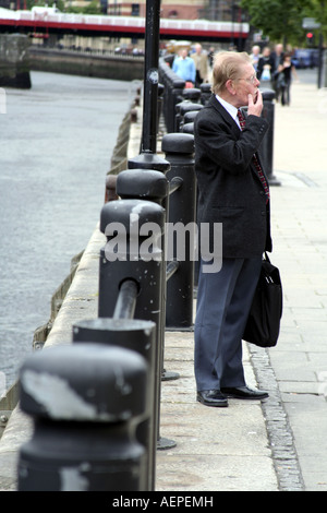 Man smoking at Quayside in Newcastle, England, UK Stock Photo