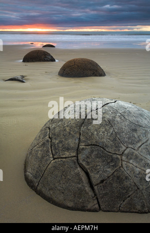 Sunrise over Moeraki Boulders, New Zealand Stock Photo