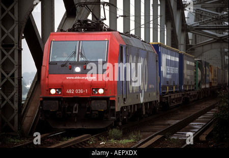 SBB cargo train, a subsidiary of Swiss Federal Railways crossing the river Rhine, Cologne, North Rhine Westphalia, Germany. Stock Photo