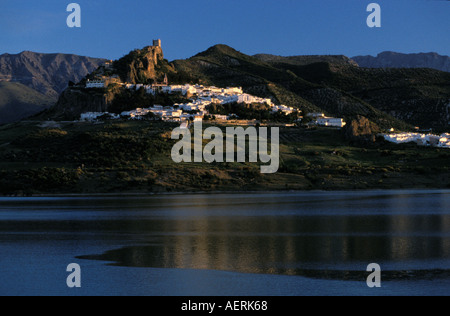 White town of Zahara de la Sierra fanning out below the castle ruins on ...