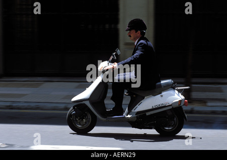 Going to work by scooter Stock Photo