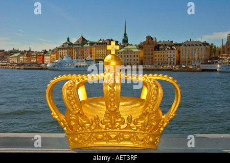 Crown the symbol of Sweden with Gamla Stan the old town district of Stockholm in the background Stock Photo