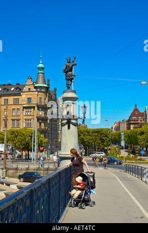 A woman looking down from Djurgårdsbron bridge, Stockholm, Sweden, Europe Stock Photo