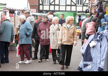 Shoppers walk around Lichfield town centre. Stock Photo