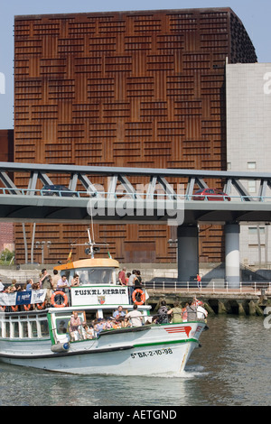 The vessel Euskal Herria on river Nervion Puente Euskalduna and Euskalduna Palace in background Bilbao Stock Photo