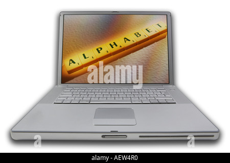 LAP TOP COMPUTER WITH SCRABBLE LETTERS ON SCREEN SPELLING WORDS ALPHABET Stock Photo