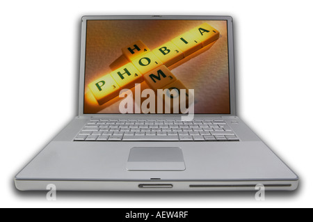 LAP TOP COMPUTER WITH SCRABBLE LETTERS ON SCREEN SPELLING WORDS HOMOPHOBIA Stock Photo