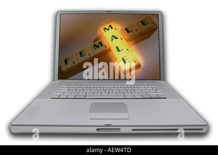 LAP TOP COMPUTER WITH SCRABBLE LETTERS ON SCREEN SPELLING WORDS MALE FEMALE Stock Photo