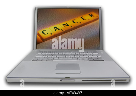LAP TOP COMPUTER WITH SCRABBLE LETTERS ON SCREEN SPELLING WORDS CANCER Stock Photo