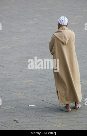 Moroccan Man in traditional dress in Marrakech's Jemaa el Fna Square Stock Photo