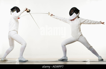 two people fencing Stock Photo