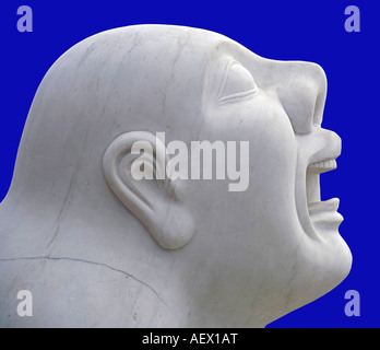 Detail of a chinese sculpture depicting a dog with the head of a man traditionally placed as guardians at compounds and palaces Stock Photo