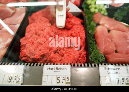 Food quality control Temperature measurement at a butcher s shop in a supermarket Stock Photo