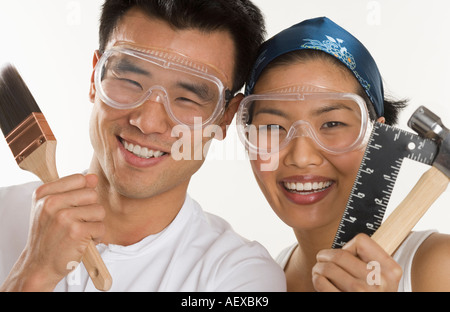 Portrait of couple doing home repairs Stock Photo