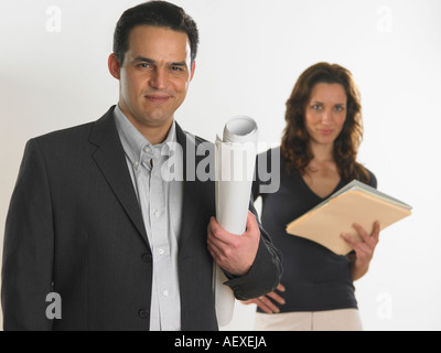 Professional male holding blueprints Stock Photo
