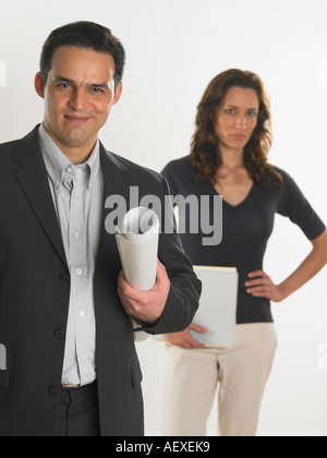 Professional male holding blueprints Stock Photo