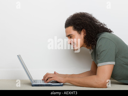 Man using a laptop computer Stock Photo