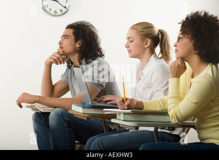 Three college students in class Stock Photo