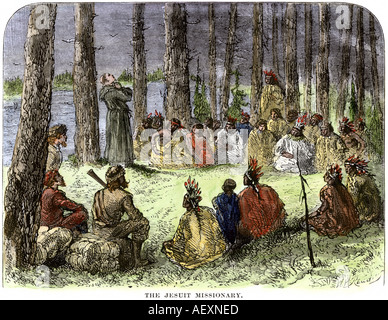 Jesuit missionary preaching to Native Americans and fur traders in the wilderness. Hand-colored woodcut Stock Photo