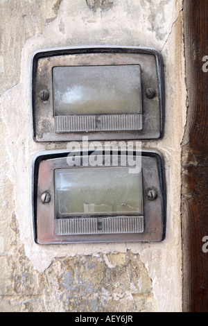 Old Door Buzzer in a complex Stock Photo