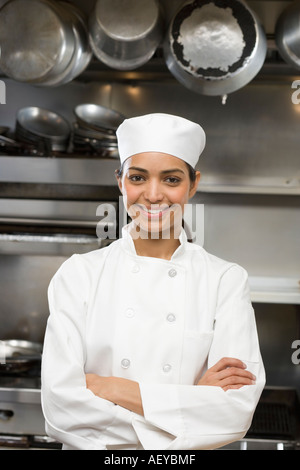 Female chef in restaurant kitchen Stock Photo