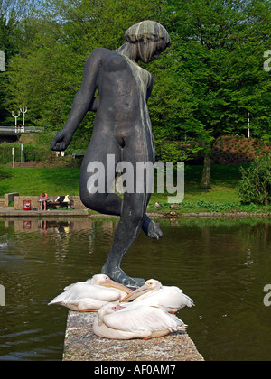 pelicans by a statue in Grugapark Essen Stock Photo
