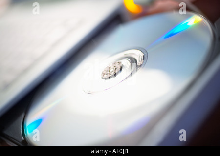 Close up of a CD in a compact disc drive Stock Photo