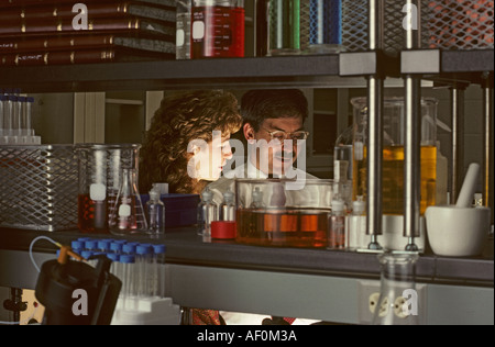 male and female scientists working in laboratory Stock Photo