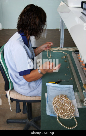 Woman working in the factory in Manacor where they make the famous Majorica pearls Mallorca Spain Stock Photo