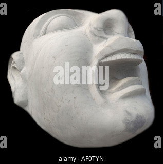 Detail of a chinese sculpture depicting a dog with the head of a man traditionally placed as guardians at compounds and palaces Stock Photo