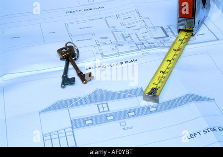 Building plans with keys and tape