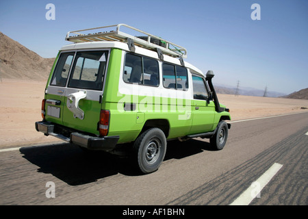 4 wheel drive overtaking on a desert road in sinai egypt Stock Photo