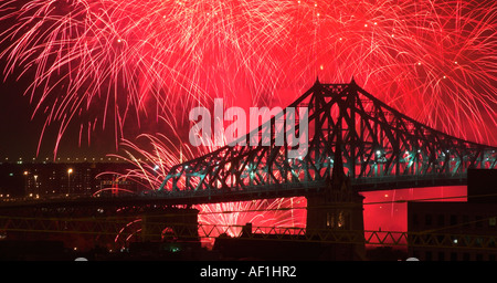 Montreal harbour bridge silhouetted against fireworks from the International Fireworks Competition Stock Photo