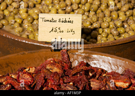 Olives and sun dried tomatoes for sale on a typical French market,Herault, Languedoc Roussillon region of the south of France Stock Photo