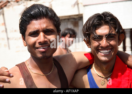 Two handsome Indian males celebrating Holi Festival at the bathing tank in Dwarka, Gujarat, India Stock Photo
