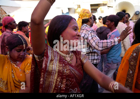 Indian female dancing in the street celebrating holi spring festival of colours, Dwarka, Gujarat, India Stock Photo