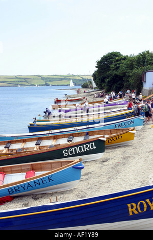Pilot gigs lined up on the beach at Mylor on The River Fal Cornwall UK Stock Photo