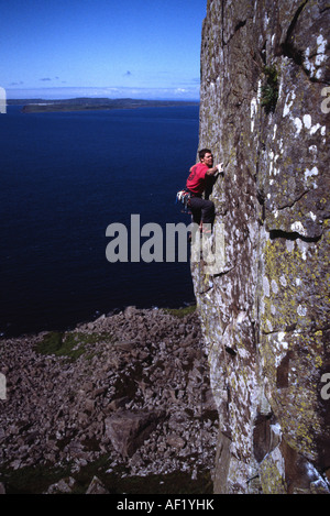 Rock climber Ricky Bell on 1st ascent of Where the Grass is Green, E7 6c, Fairhead Stock Photo