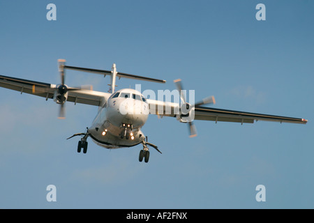 Domestic propeller airplane flying in the blue sky with cloudy Stock ...