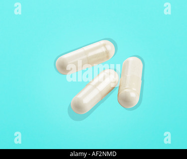 Red Rocket Stock Medicine capsules with clipping path on color background Stock Photo