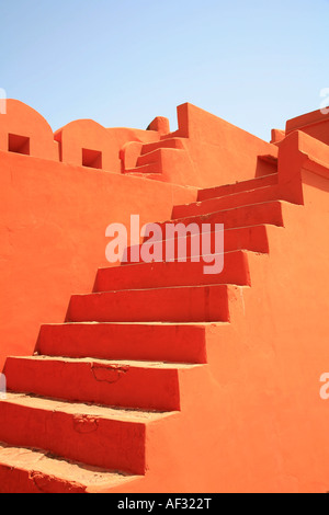 Amazing earth orange colours and shapes of wall and stairs in historical Indian Jaigarh Fort, near Amer in Jaipur, Rajasthan, India Stock Photo