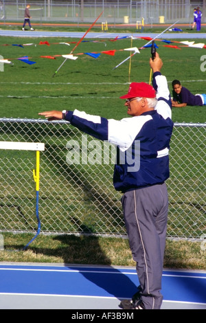 Track Start Gun Ready Set Go - Sports Official holding Starter Pistol at Starting Line ...