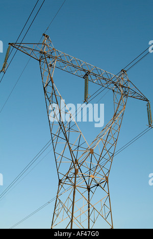 Electricity Pylon against a Blue Sky Stock Photo
