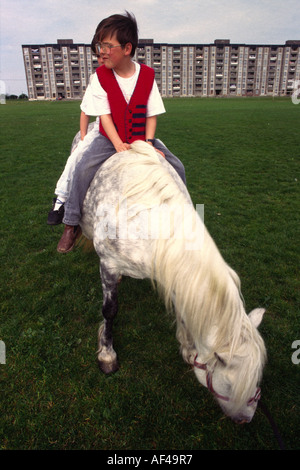 Boys with their horses on the Ballymun estate Dublin Stock Photo