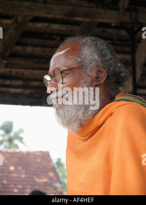 Holyman (one who performs rituals at temple) at Shri Krishna Temple, Ambalpura, Kerala, India Stock Photo