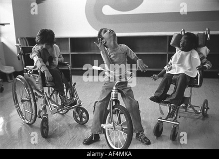 Severely disabled kids at a special hospital for kids with cerebral palsy, drug addicted babies, brain damage and other maladies. Stock Photo